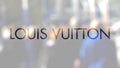 Louis Vuitton logo on a glass against blurred crowd on the steet. Editorial 3D rendering