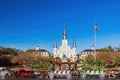Sunny view of the historical St. Louis Cathedral with many mid centry carriage at French Quarter Royalty Free Stock Photo