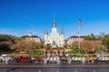 Sunny view of the historical St. Louis Cathedral with many mid centry carriage at French Quarter Royalty Free Stock Photo