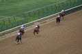 LOUISVILLE, KENTUCKY - APRIL 28, 2021: Horses approach finish line in a claiming race at Churchill Downs on Apr 28, 2021 in