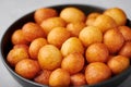 Loukoumades or luqaimat or lokma in black bowl. Popular Ramadan or Ramazan Food. Iftar or Suhur sweets