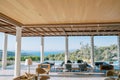 Lounge area with armchairs and sofas on a terrace with columns by the pool. Hotel Amanzoe, Peloponnese, Greece Royalty Free Stock Photo