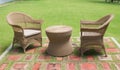 Lounge area two chairs for guests outside with green grass Royalty Free Stock Photo