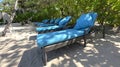 Lounge chairs or beach chairs on white sand beach in hot summer day in luxury tropical hotel Royalty Free Stock Photo