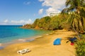 Lounge chairs on a beach in the windward islands Royalty Free Stock Photo