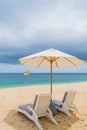 Lounge chairs on a beautiful sandy tropical beach Royalty Free Stock Photo