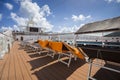 Lounge chairs on deck of cruise ship