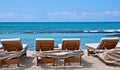 Lounge Chairs on Tropical Beach Royalty Free Stock Photo