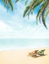 Lounge chairs on a tropical beach Royalty Free Stock Photo