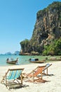 Lounge chairs on a tropical beach Royalty Free Stock Photo