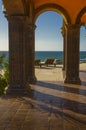 Lounge chairs on a peaceful tropical terrace in Mexico overlooking the Pacific ocean