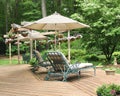 Lounge chairs under patio umbrella Royalty Free Stock Photo