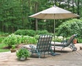 Lounge chairs under patio umbrella Royalty Free Stock Photo