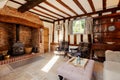 Lounge with exposed timbers and inglenook fireplace Royalty Free Stock Photo