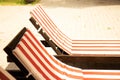 Loungers near the swimming pool on a summer day