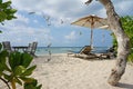 Loungers and parasol on fine sand beach