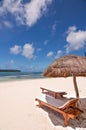 Loungers and parasol on a tropical beach, Isle of Pines Royalty Free Stock Photo