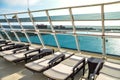 Loungers reclined on sun deck of cruise ship Royalty Free Stock Photo