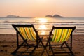 Loungers at the seaside at amazing sunset. Relax.