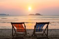 Loungers at the seaside at amazing sunset. Resort.