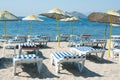 Loungers and umbrellas on beach