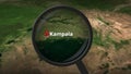 Magnifying glass finds Kampala city on the map, 3d rendering