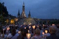 Lourdes, France, 24 June 2019: Evening procession with candles at the shrine of Lourdes Royalty Free Stock Photo