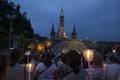 Lourdes, France, 24 June 2019: Evening procession with candles at the shrine of Lourdes Royalty Free Stock Photo