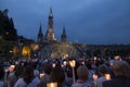 Lourdes, France, 24 June 2019: Evening procession with candles at the shrine of Lourdes Royalty Free Stock Photo