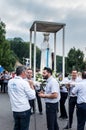 Lourdes, France June 24, 2019: Preparation for going out to the evening rosary procession at the Marian shrine in Lourdes Royalty Free Stock Photo