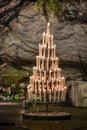 Candle display in the Massabielle Grotto in Lourdes Royalty Free Stock Photo