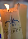 Candles glow at a shrine within the Rosary Basilica of Lourdes catholic pilgrimage site Royalty Free Stock Photo