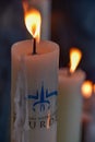 Candles glow at a shrine within the Rosary Basilica of Lourdes catholic pilgrimage site Royalty Free Stock Photo