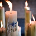 Candles glow at a shrine within the Rosary Basilica of Lourdes catholic pilgrimage site Royalty Free Stock Photo