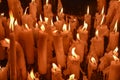 Candles glow at a shrine within the Rosary Basilica of Lourdes catholic pilgrimage site Royalty Free Stock Photo