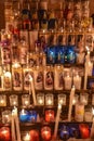 Candles glow at a shrine within the Rosary Basilica of Lourdes catholic pilgrimage site Royalty Free Stock Photo