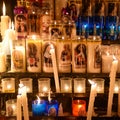 Candles glow at a shrine within the Rosary Basilica of Lourdes catholic pilgrimage site Royalty Free Stock Photo