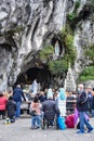 Catholic Pilgrims attend a mass services at the Massabielle Grotto at the Rosary Basilica of Lourdes Royalty Free Stock Photo