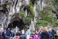 Catholic Pilgrims attend a mass services at the Massabielle Grotto at the Rosary Basilica of Lourdes Royalty Free Stock Photo