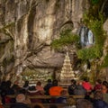 Evening Mass service at the Massabielle Grotto, Rosary Basilica, Lourdes Royalty Free Stock Photo