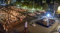 Pilgrims attend the Marian Torchlight Procession service at the Rosary Basilica in Lourdes Royalty Free Stock Photo