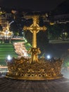 LOURDES, FRANCE - SEPTEMBER 14 2019: Cross in front of the candle procession, every night in Lourdes, France, Europe Royalty Free Stock Photo