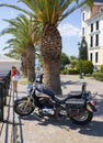 Loutra Edipsou, Evia island, Greece. September 2020: a motorcycle cruiser stands on the waterfront of a Spa resort against the bac