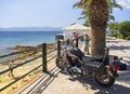 Loutra Edipsou, Evia island, Greece. September 2020: a motorcycle cruiser stands on the waterfront of a Spa resort against the bac