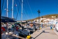 LOUTRA, Greece. Pier in Loutra Marina Kythnos with sailing boats moored, Cyclades Islands, Greece. Royalty Free Stock Photo