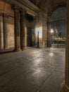 Louvre courtyard archway lit by evening lamp, Paris, France