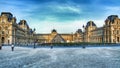 Louvre Museum and glass piramid in Paris Royalty Free Stock Photo