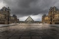 Louvre museum in black and white with reflection in a puddle. Louvre museum is one of the world`s largest museums with more than Royalty Free Stock Photo