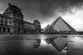 Louvre museum in black and white with reflection in a puddle. Louvre museum is one of the world`s largest museums with more than Royalty Free Stock Photo
