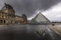 Louvre museum in black and white with reflection in a puddle. Louvre museum is one of the world`s largest museums with more than Royalty Free Stock Photo